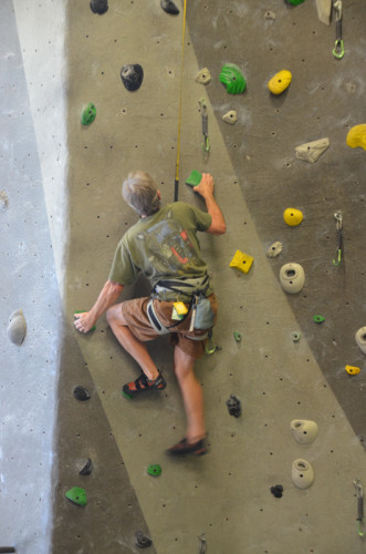 The author on a 5.10 at High Point Climbing and Fitness